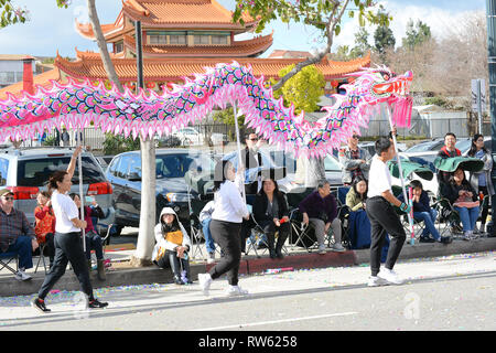 LOS ANGELES - FEBRUARY 9, 2019:  Dragon bearers at the Golden Dragon Parade, celebrating the Chinese New Year. Stock Photo