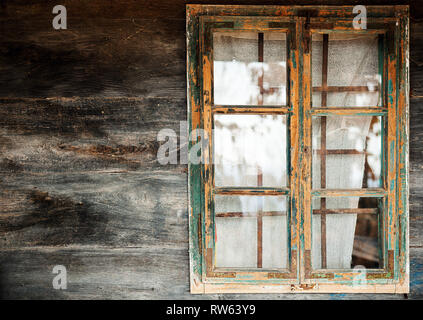 Abstract of an old wooden house, closeup view on wooden window frame and wall. Stock Photo