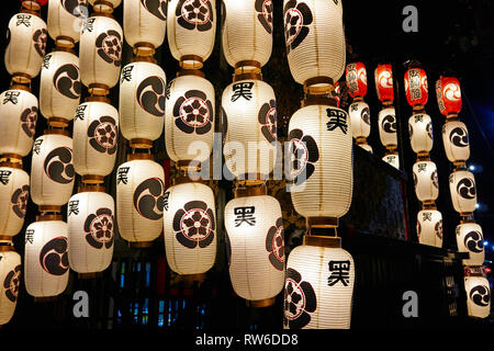 Lanterns on yamaboko floats are illuminated on a summer evening during Yoiyama Gion Matsuri Festival in Kyoto Stock Photo