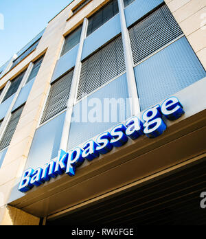 Karlsruhe, Germany - Oct 29, 2017: Bankpassage sign on the bank building - low angle view of modern German architecture - square image Stock Photo