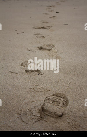 Footprints in the sand Stock Photo