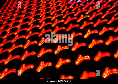 Orange-red glowing patterns on the dark background. Closeup horizontal photo. Stock Photo