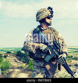 Close-up photo of U.S. Marine with his rifle. Stock Photo