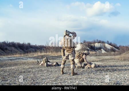 Squad of U.S. Marines waiting for medevac. Stock Photo