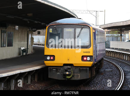 Class 144 Pacer dmu, unit number 144 022, leaving platform 2 at Carnforth station on Monday 4th March 2019. Stock Photo