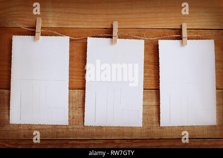 Blank vintage images on wooden background Stock Photo