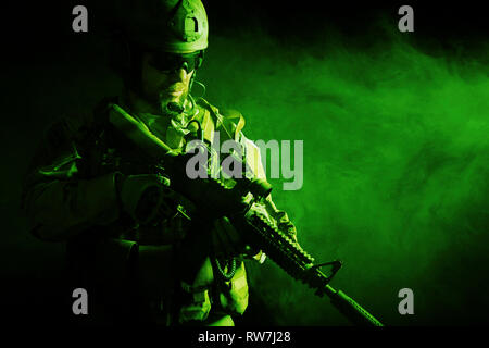 Bearded special forces soldier in the smoke. Stock Photo