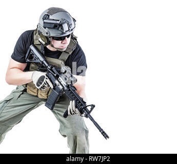 Studio shot of private military contractor PMC with assault rifle. Stock Photo
