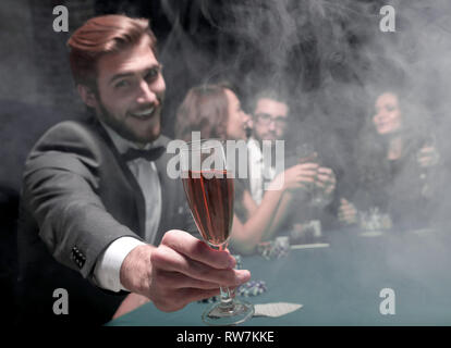 poker player with a glass of wine Stock Photo