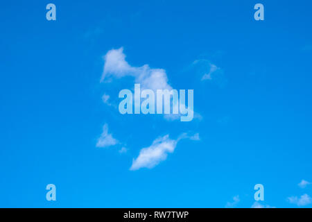 Clear blue sky with thin white clouds over the Adirondack Mountains, NY USA on a cold winter day. Stock Photo