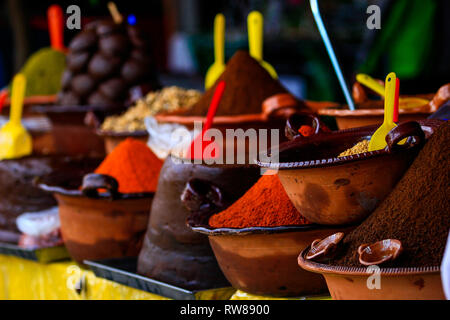 Several handmade clay pot with podwer to prepare traditional mexican dish mole Stock Photo