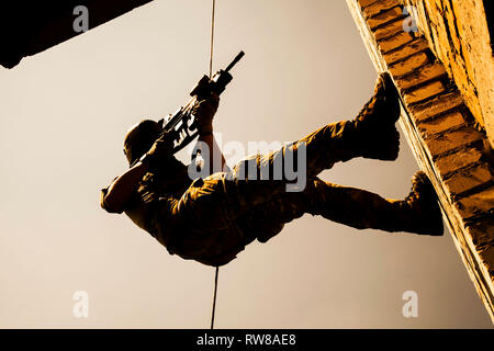 Fbi Rappelling Soldier during assault rappelling exercises with weapons Stock Photo ...