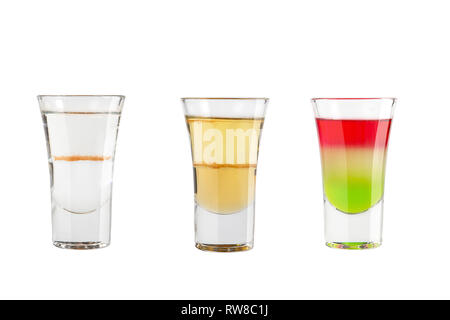 Set of alcohol shots on a white background. Three shots with different types of alcohol. Isolated. Stock Photo