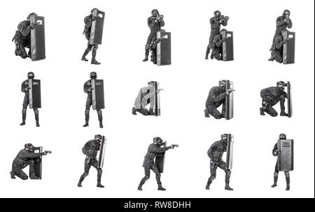 Set of SWAT operators in black uniforms and bulletproof vests with ballistic riot shield. Stock Photo