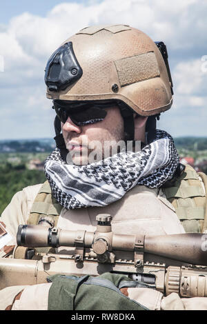 Member of Navy SEAL Team with weapons in action. Stock Photo