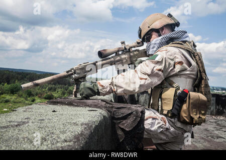 Member of Navy SEAL Team with weapons in action Stock Photo