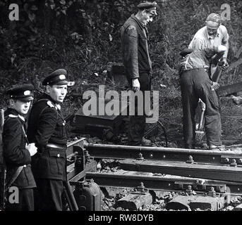 Guarded Construction Workers Demolishing Train Tracks on Thursday Morning (Sept. 28) at Wornholmer Strasse at the Border to West Berlin District Reinickendorf Stock Photo