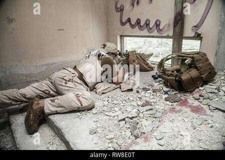 Navy Seal sniper with rifle in action. Stock Photo