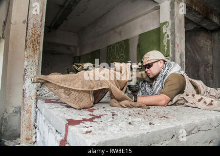 Navy Seal sniper with rifle in action. Stock Photo