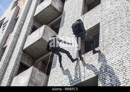 Spec ops police officers SWAT during assault operation. Stock Photo