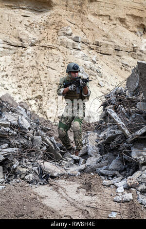 Member of Navy SEAL Team with weapons in action. Stock Photo