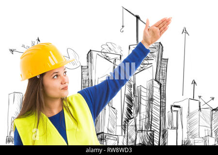 Young female architect presenting with hand gesture corner of city building sketch while wearing work attire Stock Photo