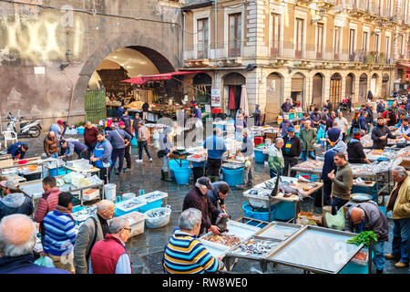 Fishermen selling fish on the famous fish market in Catania. Sicily, Italy Stock Photo