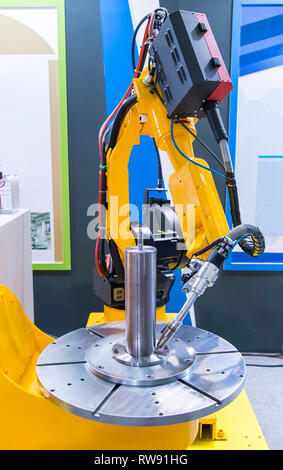Welding robot in the process Stock Photo