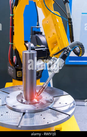 Welding robot in the process Stock Photo