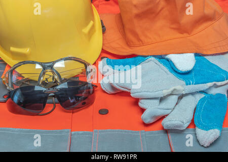 Obligatory protective equipment of radicals working on jobs at risk of injuries at work Stock Photo