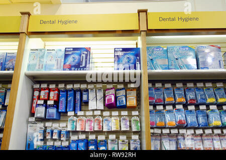 Rows of intersticks, electric toothbrushes and other teeth cleaning products for sale in John Bell and Croydon, London Stock Photo