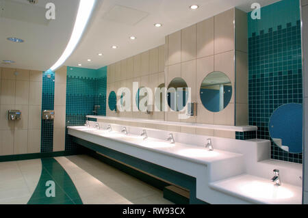 Mirrors and basins in a public restroom Stock Photo