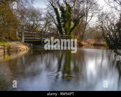 Misty morning light on the River Meon near Exton, South Downs National Park, Hampshire, UK Stock Photo