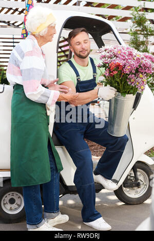 Delivery Man with Flowers Stock Photo