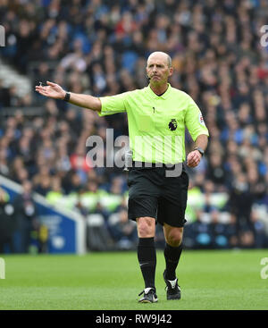 Referee Mike Dean during the Premier League match between Brighton & Hove Albion and Huddersfield Town at the American Express Community Stadium . 02 March 2019 Stock Photo