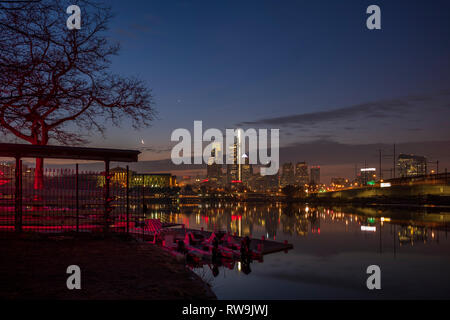 The crescent moon and Venus are viewed over the Philadelphia skyline before sunrise from Boathouse Row along the Schuylkill River. Stock Photo