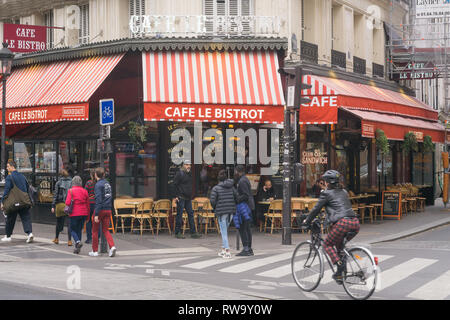 Paris street scene on Boulevard Magenta, in front of the cafe Le Bistrot, in the 10th arrondissement. France. Stock Photo