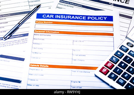 Car Insurance Policy. Documents, Pen and Calculator on Table Stock Photo