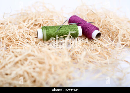 Spool of two thread with needle. Isolated on the white background. Stock Photo