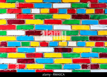 Colored brick wall from multicolored bricks as a creative background Stock Photo