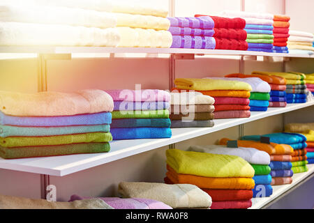 Colored terry towels on store shelves Stock Photo