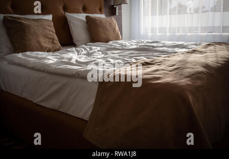 Empty double bed in the room Stock Photo