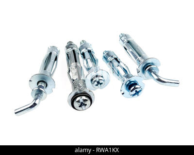 Metal expansion anchor dowels for plasterboard, drywall or hollow wall, isolated on white Stock Photo