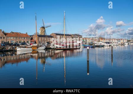 City view with harbour and windmill De Hoop, Hellevoetsluis, South Holland, Netherlands Stock Photo