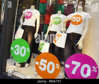 Discount, discount 50 percent, special sale, sales, shop window with mannequins from a textile shop, Belgium Stock Photo