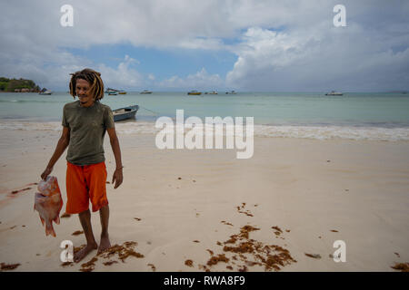Fishing on tropical island beach. Photographed in Seychelles Stock Photo