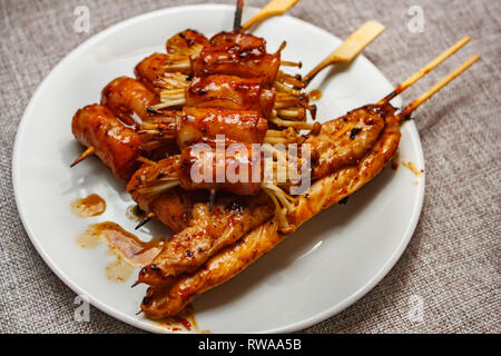 Mala is Grilled meat (Beef, Pork, Chickens or Mushroom) with chilli sauce and chinese hot spicy herb, street food. Stock Photo