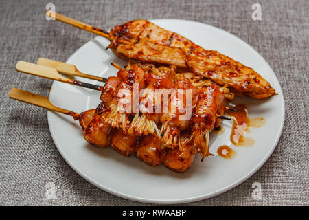 Mala is Grilled meat (Beef, Pork, Chickens or Mushroom) with chilli sauce and chinese hot spicy herb, street food. Stock Photo