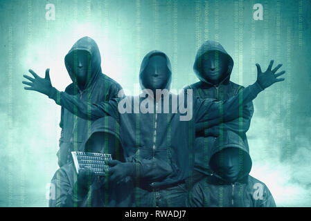 Hacker groups in black hoodie standing with binary code on virtual screen over green background Stock Photo