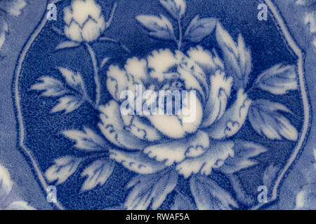 Abstract ceramic blue and white Japanese floral design ceramic plate background close up overhead photo Stock Photo